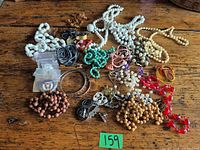 Top view of entire lot displaying various necklaces, bracelets, bangles, earrings and small jewelry items