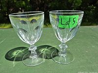 Front view showing both crystal wine glasses