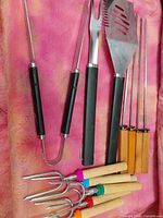 Full view of spatula, carving fork, tongs, skewers and roasting forks
