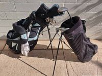 Two stand bags side by side, clubs and accessories visible