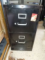 Front view showing two drawers with handles and label frames