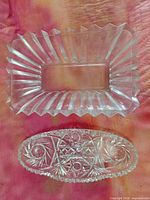 Both clear pressed glass pieces together