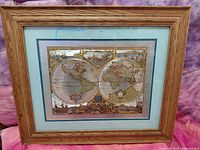 Front view of framed map print under glass in oak-tone frame
