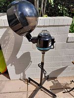 Full view of hood hair dryer on stand