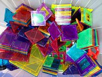 Top view of loose magnetic tiles showing mixed shapes and colors