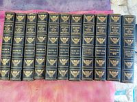 All eleven gilt-spined leather volumes lined up