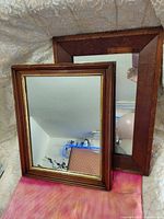 Both mirrors front view showing frames and gold trim