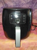 Front view of Philips air fryer showing control panel and handle