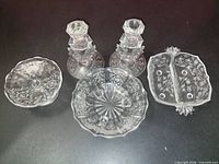 Group shot of all five pressed and etched glass pieces