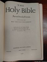 Title page showing Revised Standard Version Holy Bible, publisher Thomas Nelson & Sons, and 1952 date