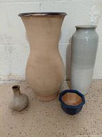 Front view of four ceramic pieces