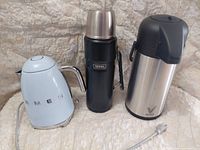 Three beverage containers: Smeg kettle, Thermos flask, Vondior airpot