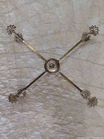 top view of holder partially expanded showing overall form and floral arm ends