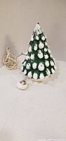 Front view of ceramic Christmas tree with cord and socket