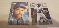 Fronts of both baseball cards showing players and price stickers