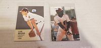 Fronts of Luis Medina and Ricky Jordan baseball cards in sleeves