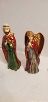 Front view of both figurines showing details and coloration
