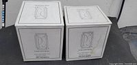 two unopened Paul Sebastian Fine Crystal boxes