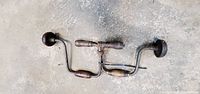 Two vintage hand brace drills side by side, full view
