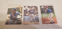 Front view of all three cards showing player images and overall condition