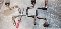 Four hand brace drills and file tied together, showing overall condition