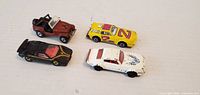 Top view of four diecast cars