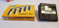 Atlas Viaduct Kit box front beside Weslo controller front view