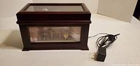 Wood music box with power adapter shown