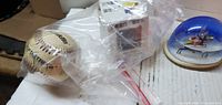 Baseball, boxed cube, snow globe overall view
