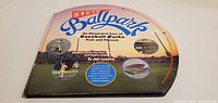 Front cover showing title, author, imagery of baseball parks