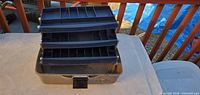 Tackle box open showing three trays