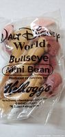 Front of sealed Bullseye Mini Bean plush showing Walt Disney World and Kellogg’s printing