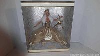 Front view of boxed Celebration Barbie showing doll and packaging