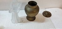 Angel figurine, brass incense burner body, lid laid aside