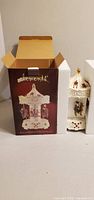 Carousel in foam inserts next to retail box