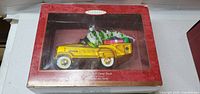 Front of sealed Hallmark Keepsake box showing 1955 Murray Dump Truck ornament