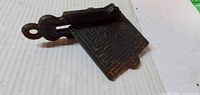 Top view of cast iron maze puzzle folded open