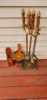 Full view of fireplace tool set, bellows, match holder