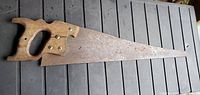 Full view of hand saw showing blade and handle