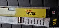 Front view of sealed laser level showing entire tool and included battery