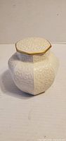 Front view of Lenox octagonal lidded trinket jar