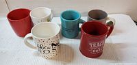 Front angled view of all six mugs