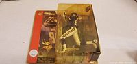 Front view of sealed Randy Moss figure in yellowed clamshell