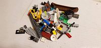 pile of assorted Lego pieces showing major elements