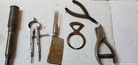 All six tools laid out on white corrugated surface