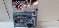 Front view of sealed Dale Earnhardt figure on card
