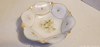 Top view showing entire bowl, scalloped shape, floral design