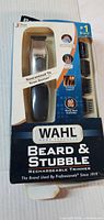 Front of box showing Wahl Beard & Stubble rechargeable trimmer and three guide combs
