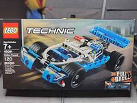 Front of sealed LEGO Technic 42091 box showing set details and age recommendation