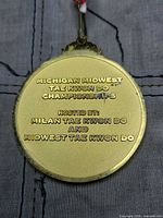 Reverse of medal displaying event inscription